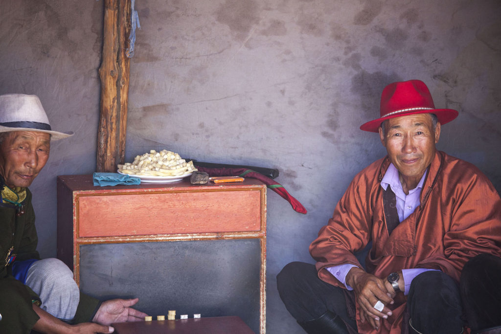 Mongolian men playing Shagai