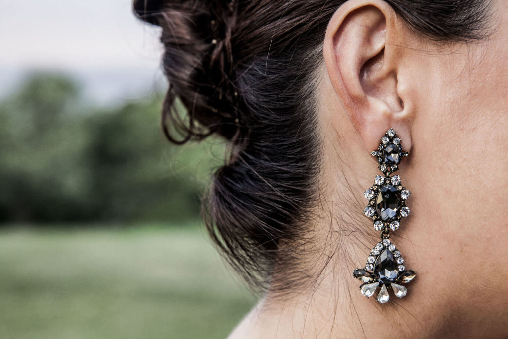 Earrings on wedding guest at Crane Estate reception New England USA