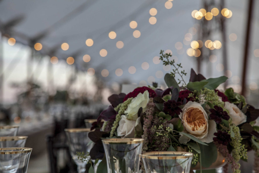 Flowers on dinner table wedding reception Crane Estate New England USA