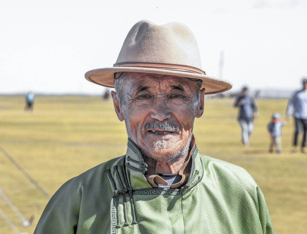 Old Mongolian man wearing hat