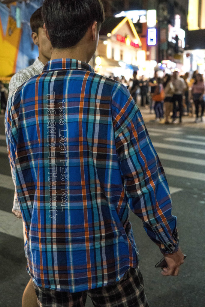 Young man walking the streets of Seoul, South Korea