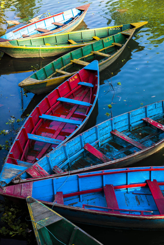 Colourful boats on lake in Pokhara, Nepal