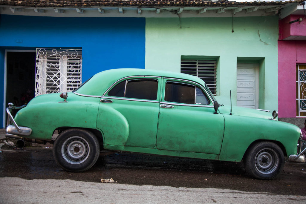 Colourful car and house in Trinidad, Cuba