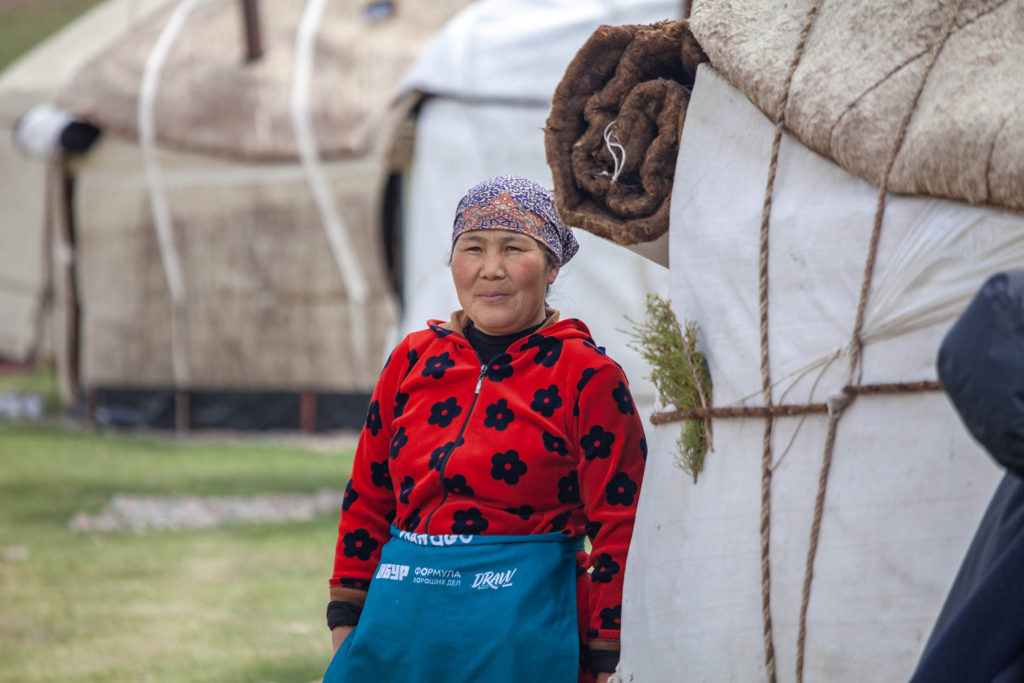 Kyrgyz woman at camp in valley en route to Song Kul, Kyrgyzstan