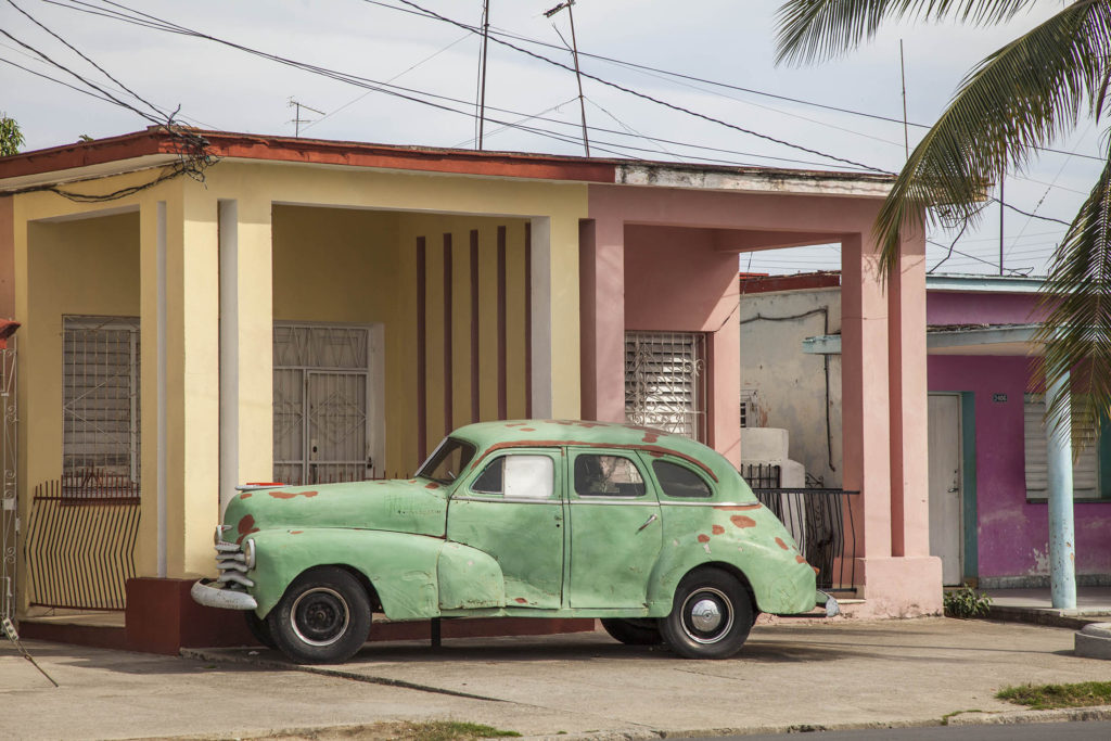 Old car and building in Cienfuegos, Cuba