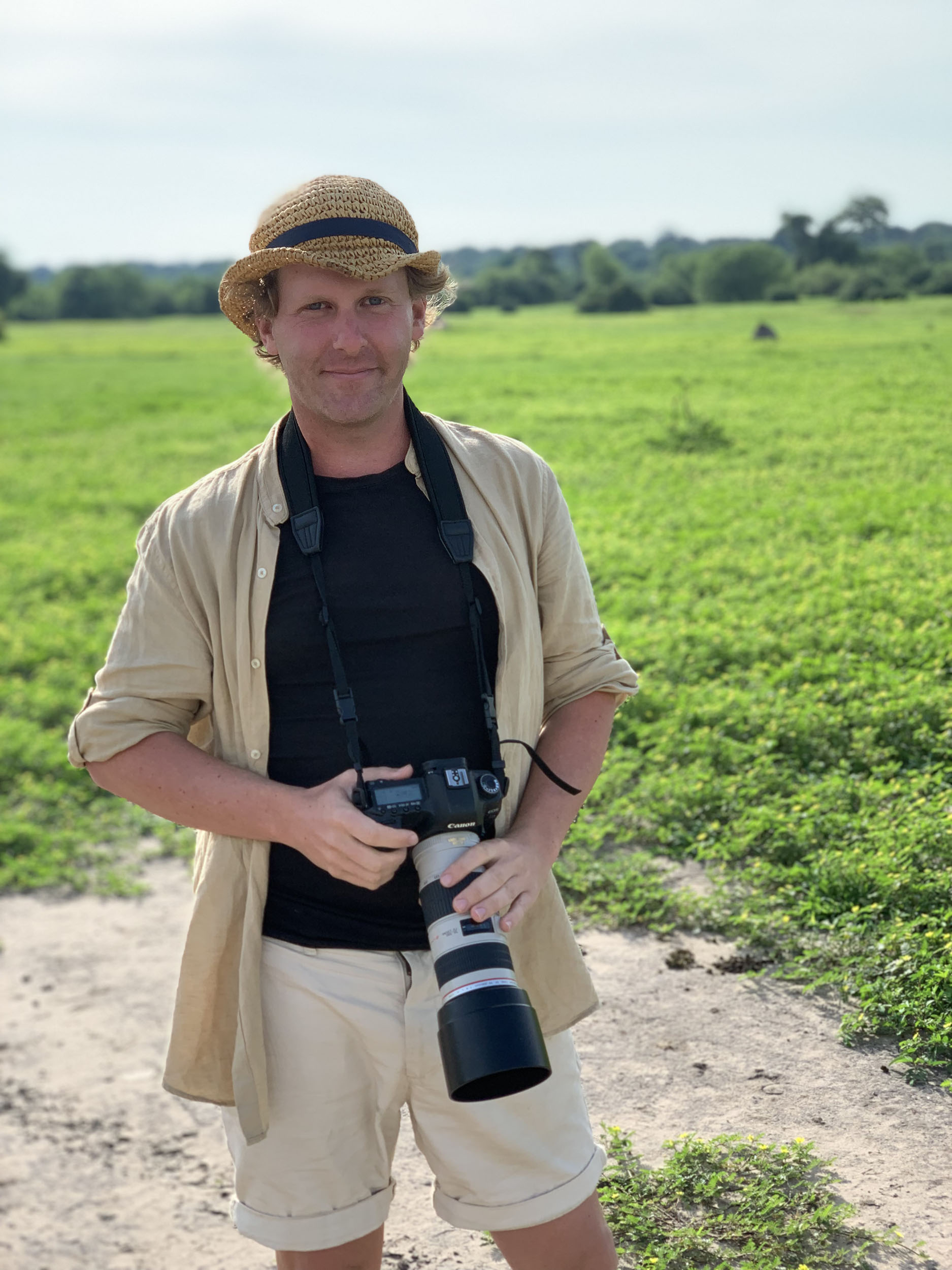 Ben with camera inside Chobe National Park in Botswana